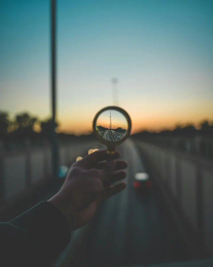 Unsplash image for hands holding printed zine outdoors